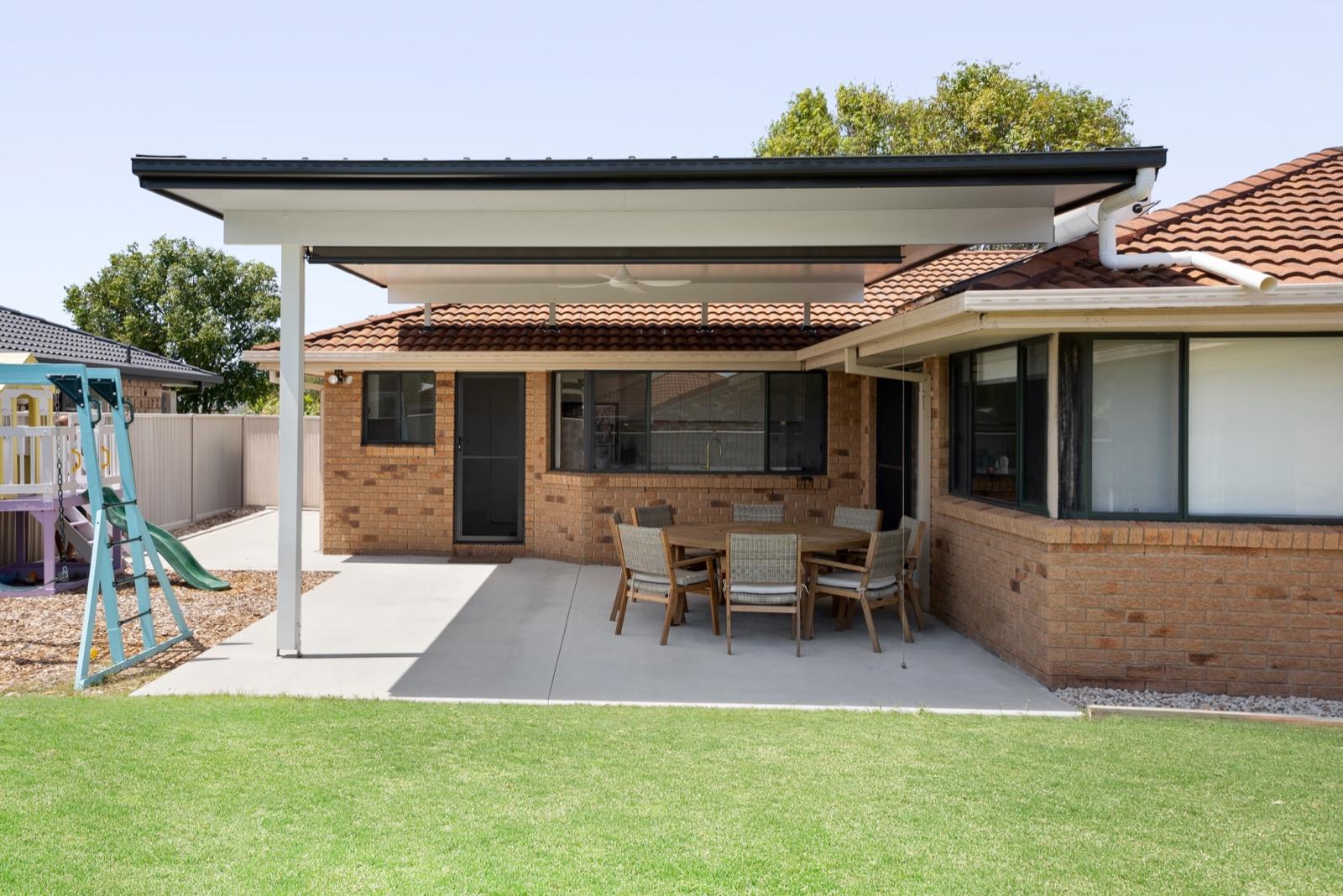 The same space finished — flat-roof patio built by us